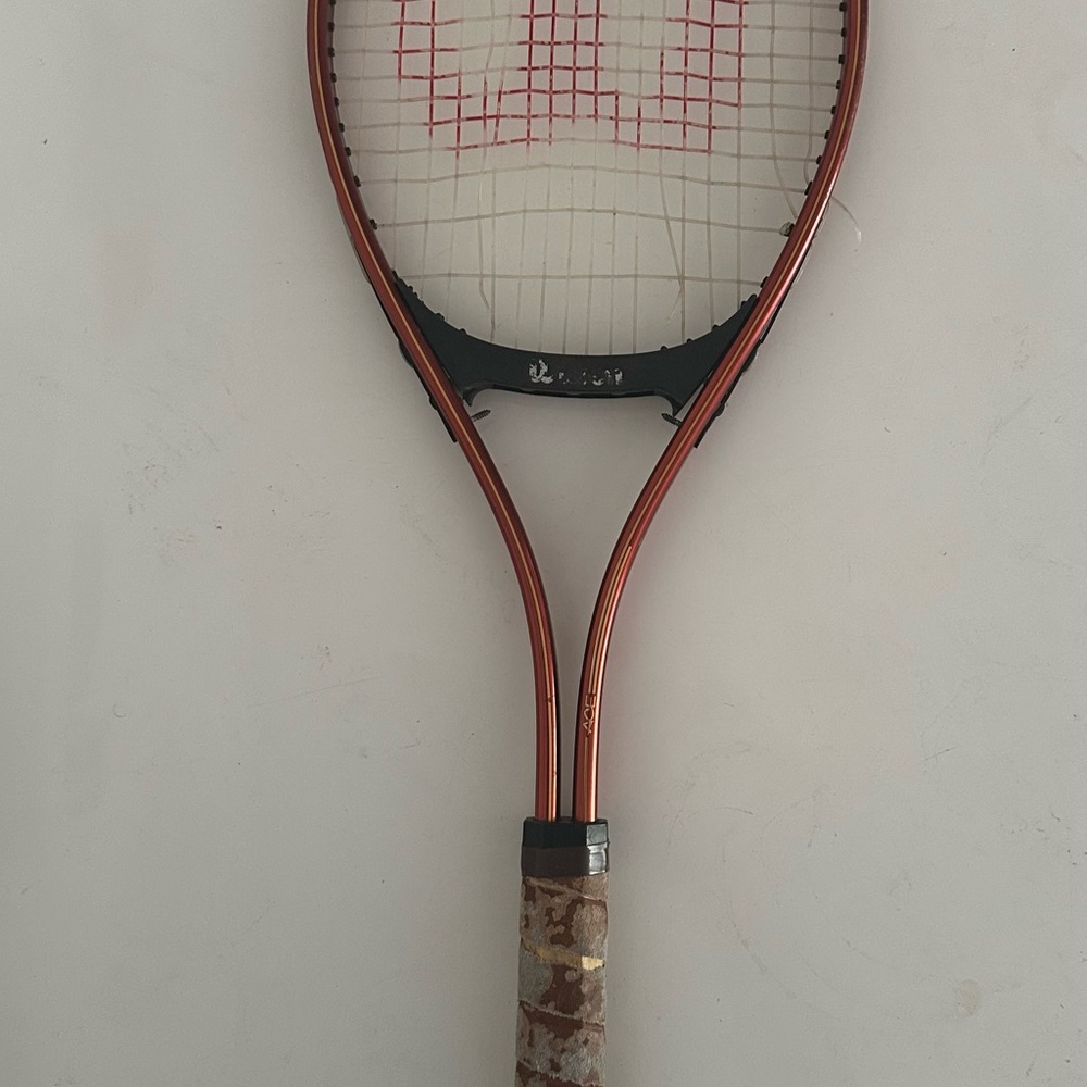 Wilson Tennis Racket in Copper and Black with Red Stringing